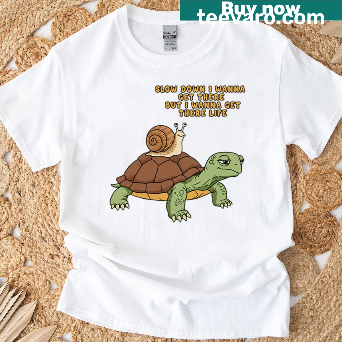 Wholesome t-shirt with turtle and snail graphics promoting slow living — on a men's t-shirt
