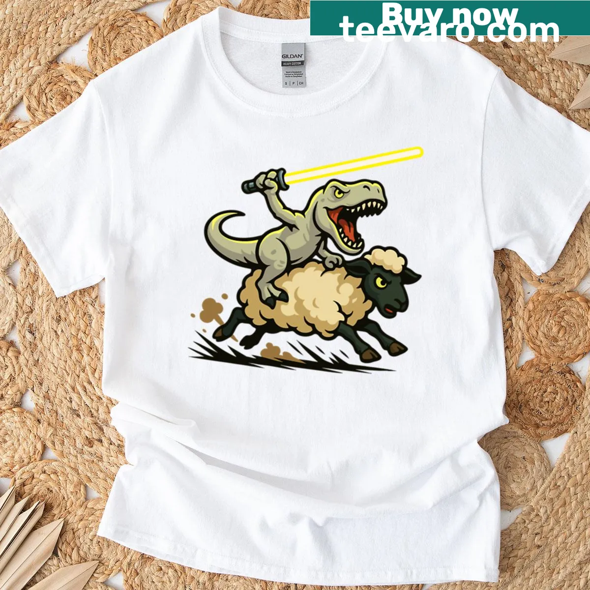 T-shirt depicting a T-rex riding a sheep with a light sword — on a men's t-shirt