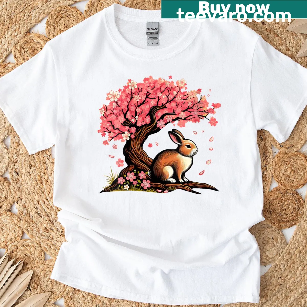 Kawaii T-shirt featuring a rabbit and cherry blossoms in a cute design. — on a men's t-shirt