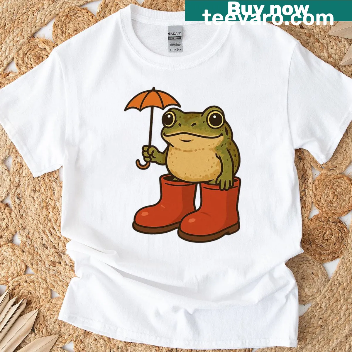 Whimsical frog holding an umbrella design on a t-shirt — on a men's t-shirt