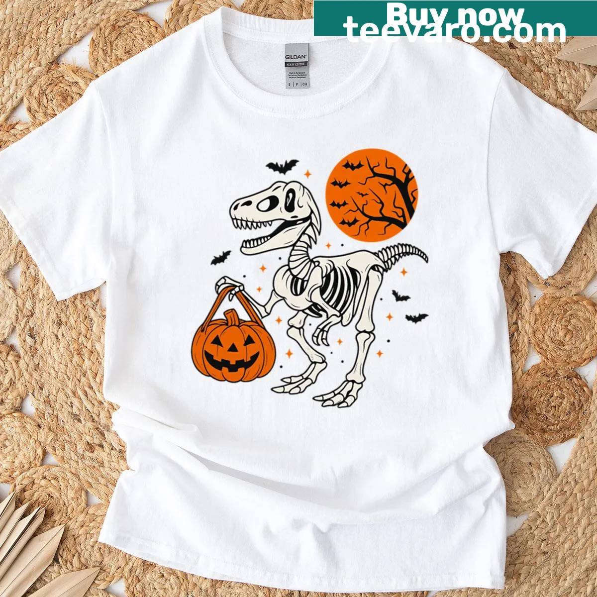 Oversized T-shirt featuring dinosaur skeleton with pumpkin — on a men's t-shirt