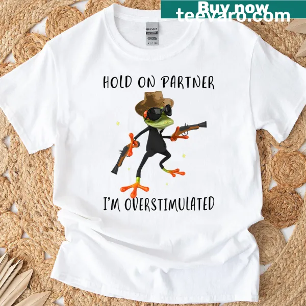 Cowboy frog graphic with text 'Hold On Partner, I'm Overstimulated'