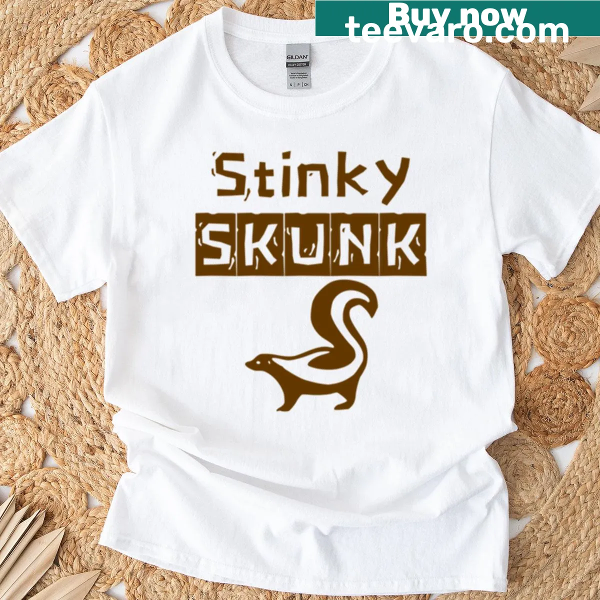 Brown t-shirt featuring a playful skunk graphic — on a men's t-shirt