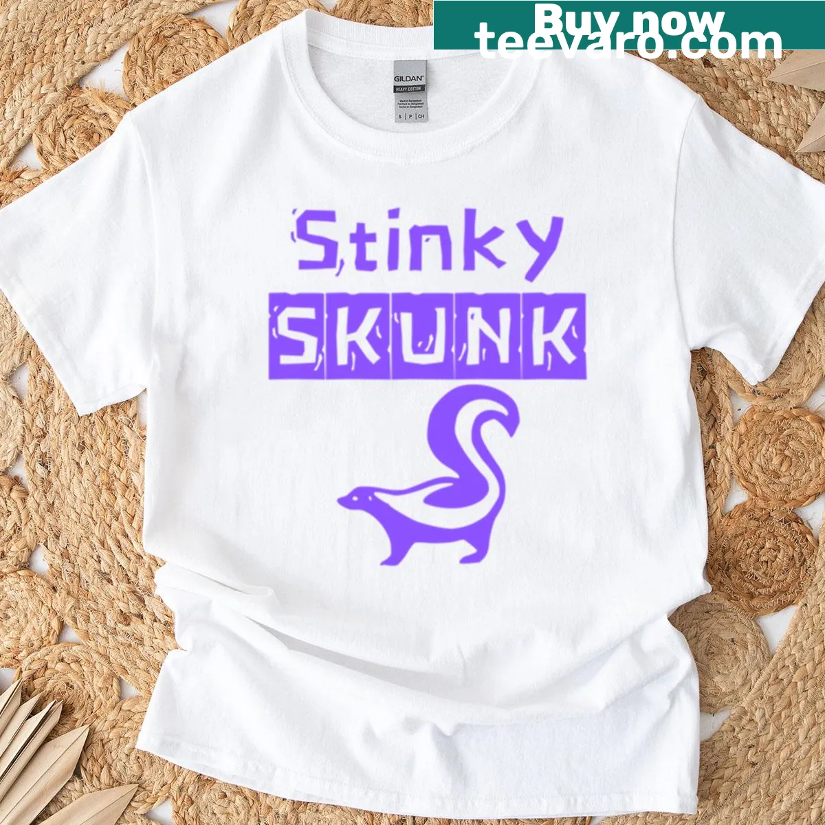 Purple t-shirt with a whimsical skunk graphic — on a men's t-shirt