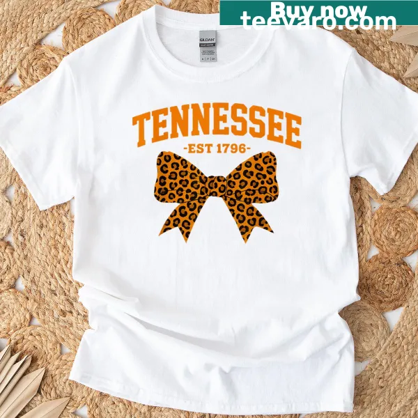 T-shirt featuring plaid and leopard print designs with a bow, showcasing Tennessee pride.