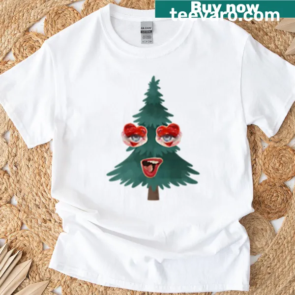 Whimsical Christmas tree with a face graphic on a T-shirt