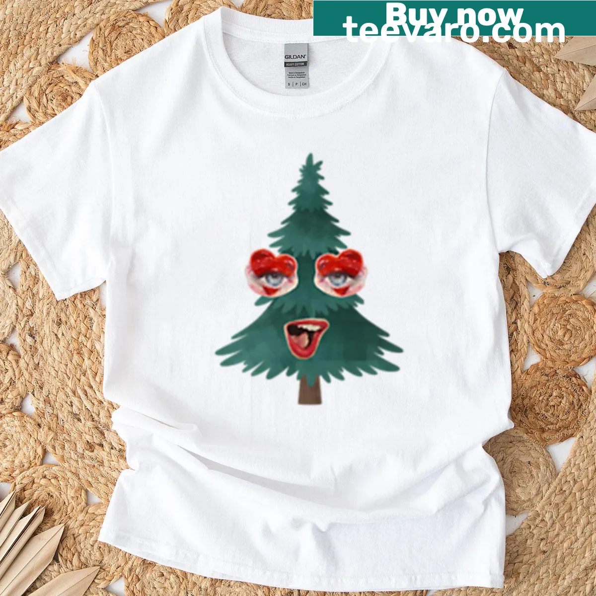 Whimsical Christmas tree with a face graphic on a T-shirt — on a men's t-shirt