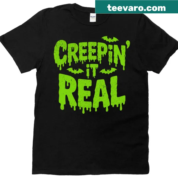 Halloween tee with playful green slime graphic and 'Creepin It Real' text