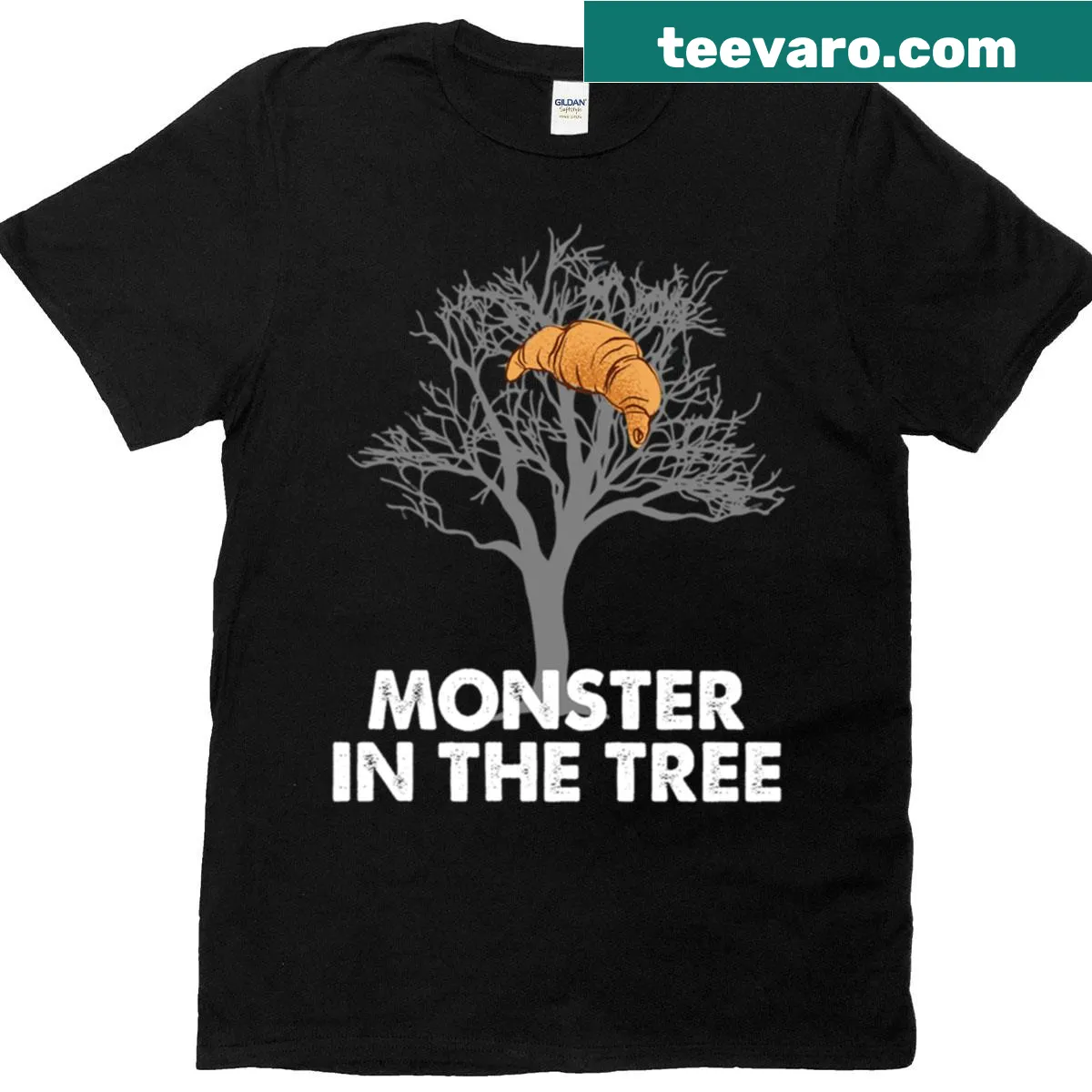 Funny tee featuring a croissant monster in a tree — on a men's t-shirt