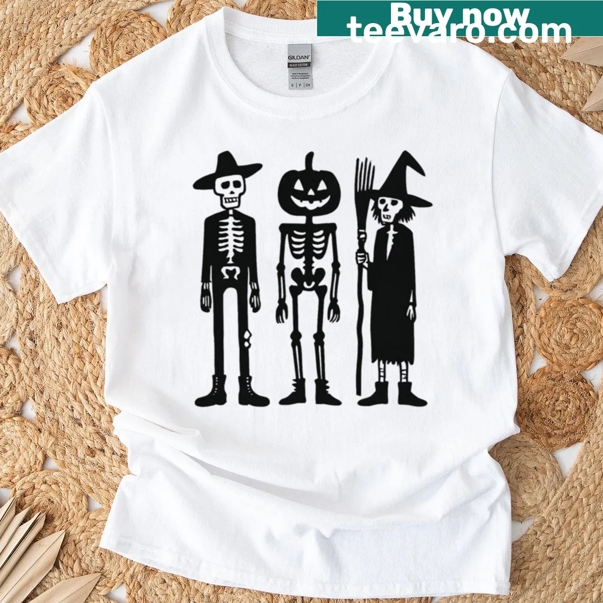 Cartoon graphic of skeleton and witch trio on a T-shirt — on a men's t-shirt