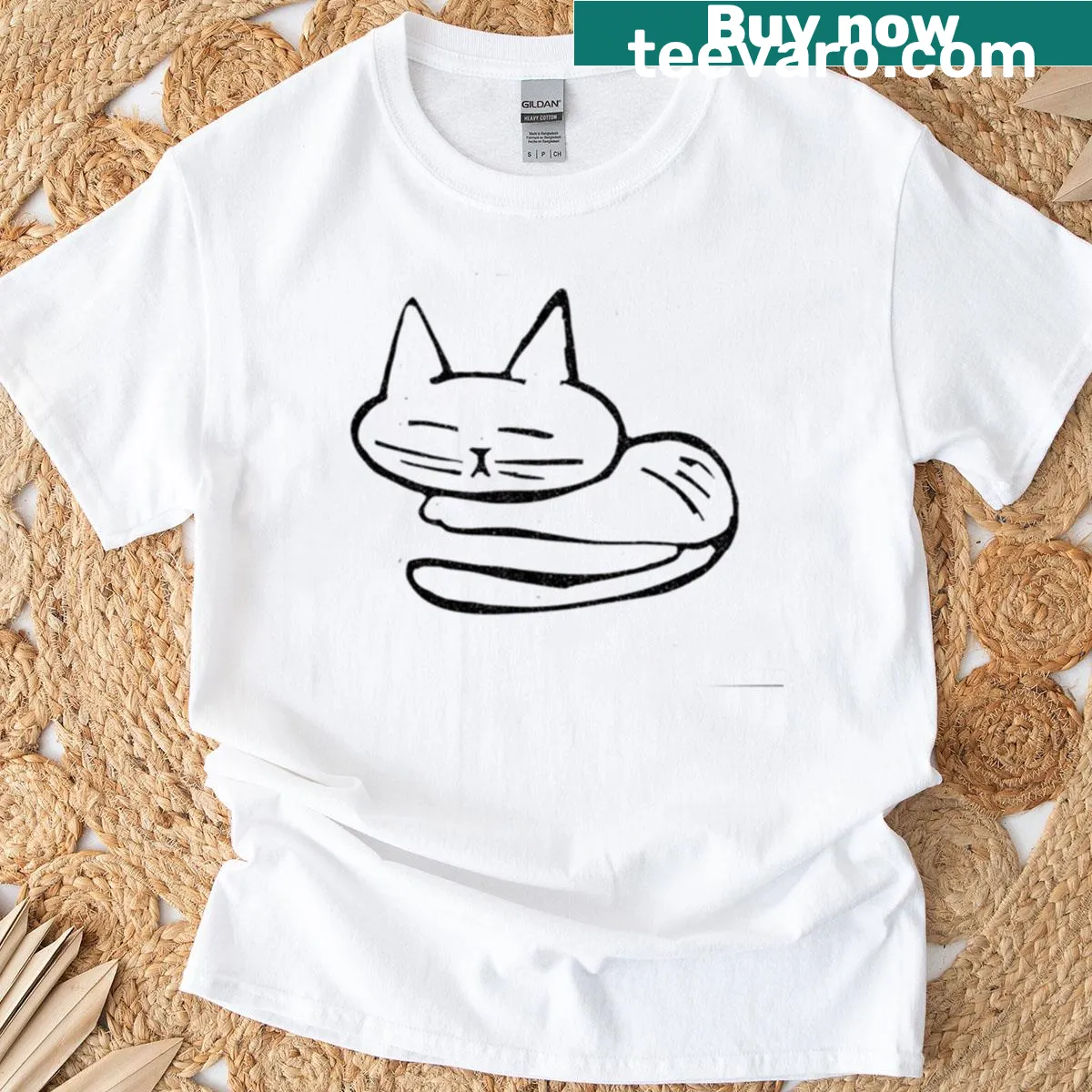 T-shirt featuring a peaceful illustration of a napping cat — on a men's t-shirt
