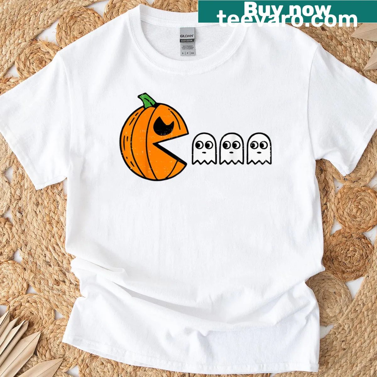 Cartoon ghost eating a pumpkin on a Halloween t-shirt — on a men's t-shirt