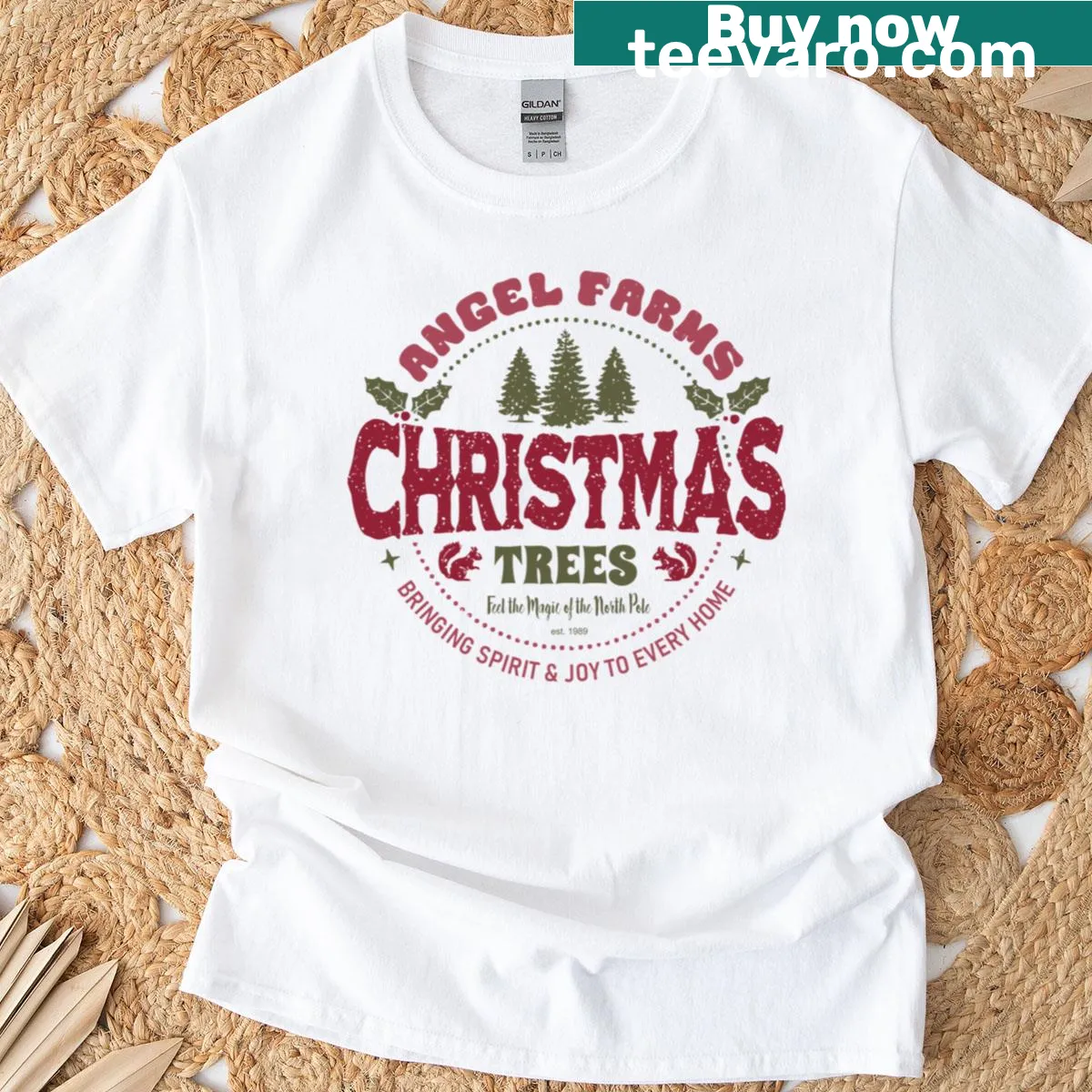 Vintage rustic Angel Farms Christmas Trees logo graphic on T-shirt — on a men's t-shirt