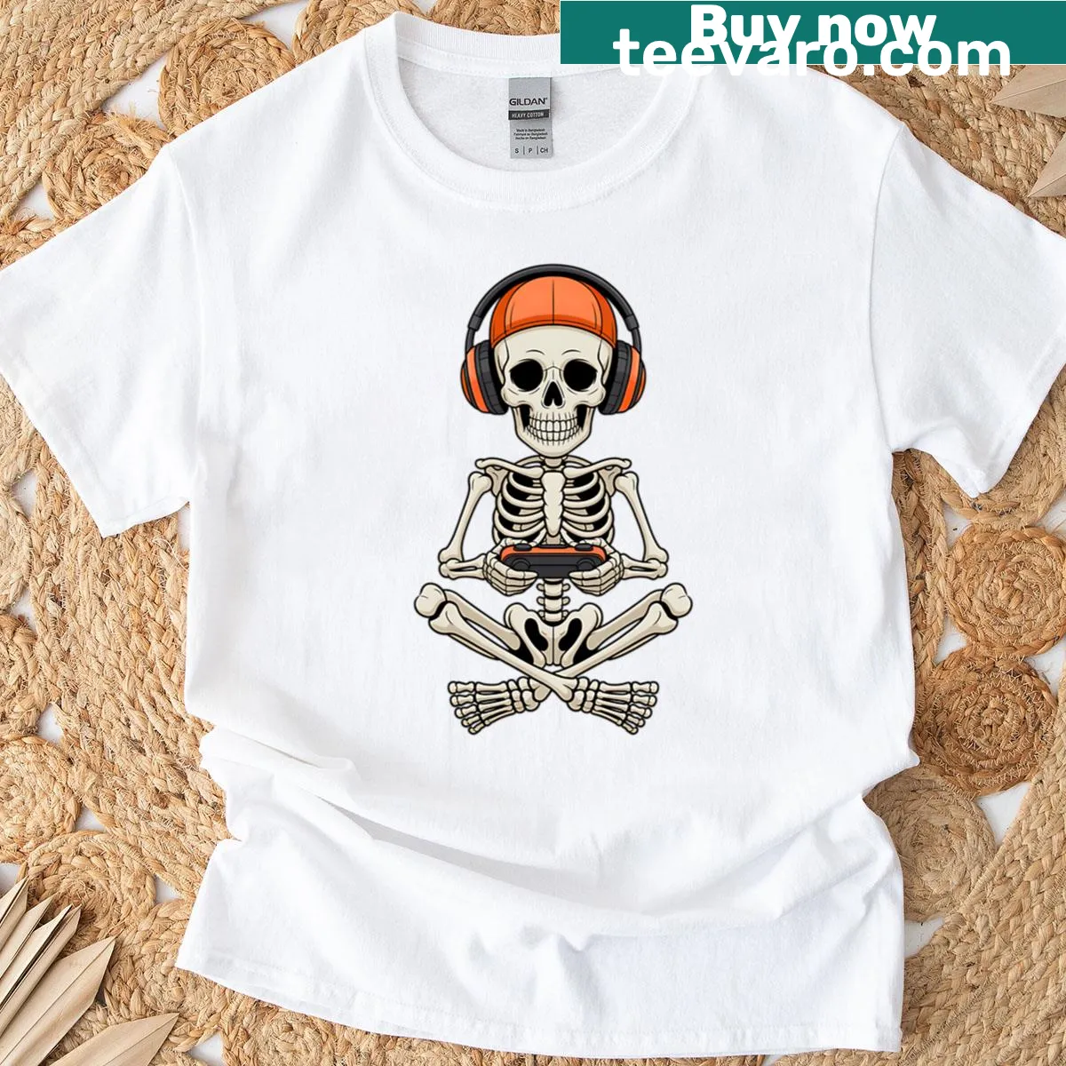 Halloween t-shirt featuring a skeleton playing video games — on a men's t-shirt