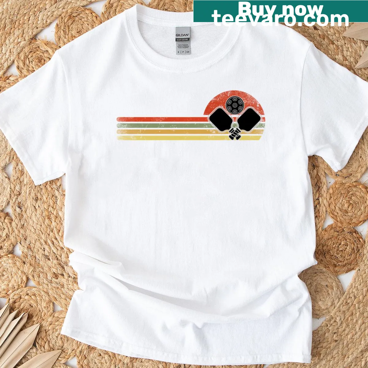 Retro-style T-shirt featuring a vintage pickleball player graphic — on a men's t-shirt
