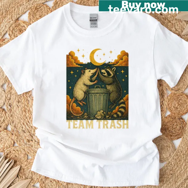 Vintage-style T-shirt featuring crescent moon, opossum, and raccoon graphics