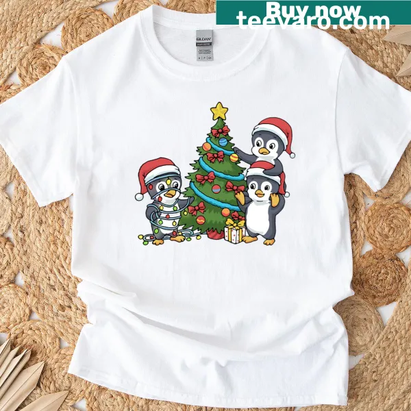 Cute Christmas T-shirt with penguins and tree illustration