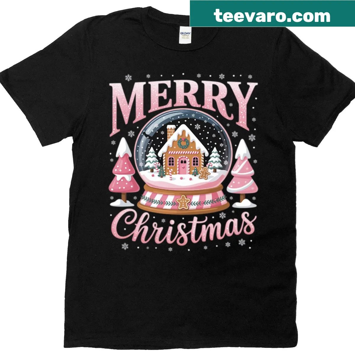 Cute Christmas T-shirt featuring a pink gingerbread house in a snow globe — on a men's t-shirt