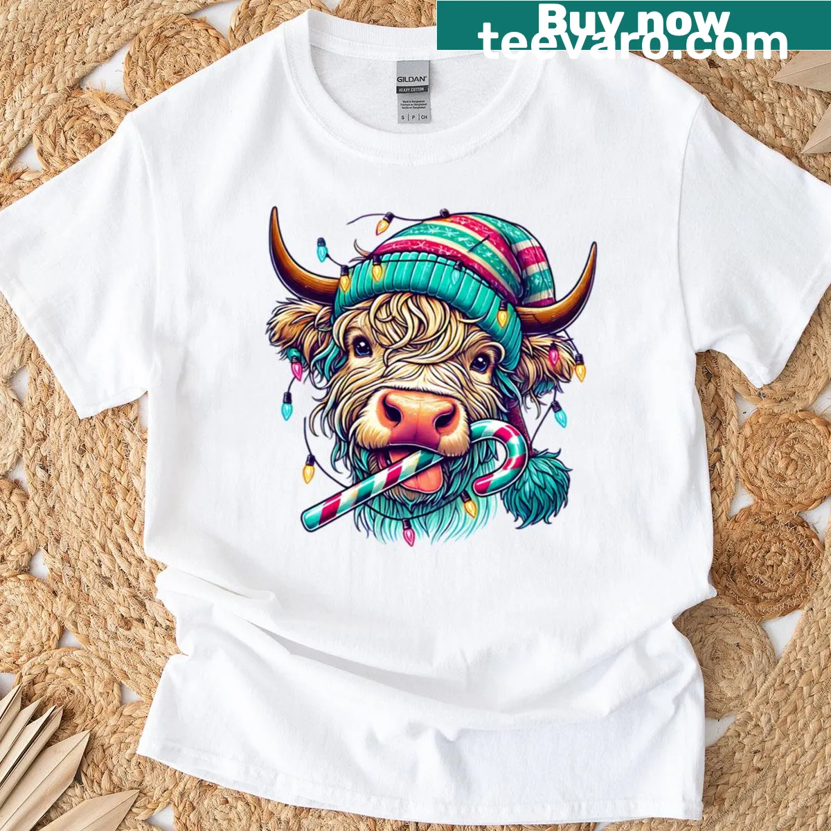 Highland cow decorated with Christmas lights and candy cane graphic. — on a men's t-shirt