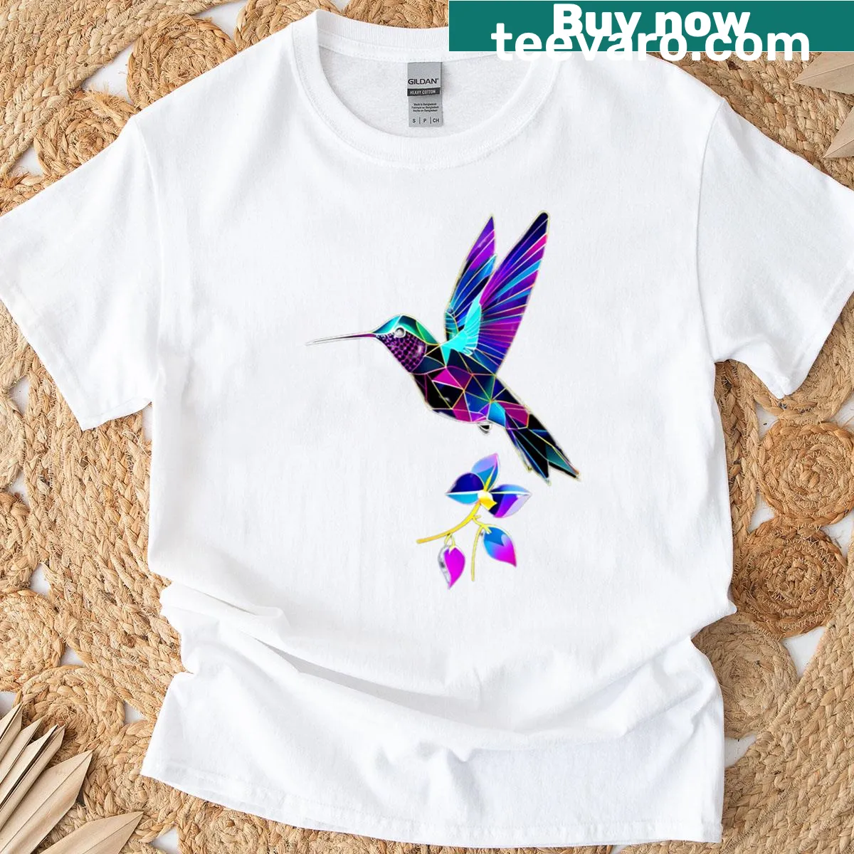 Geometric line art t-shirt depicting a hummingbird with floral accents. — on a men's t-shirt