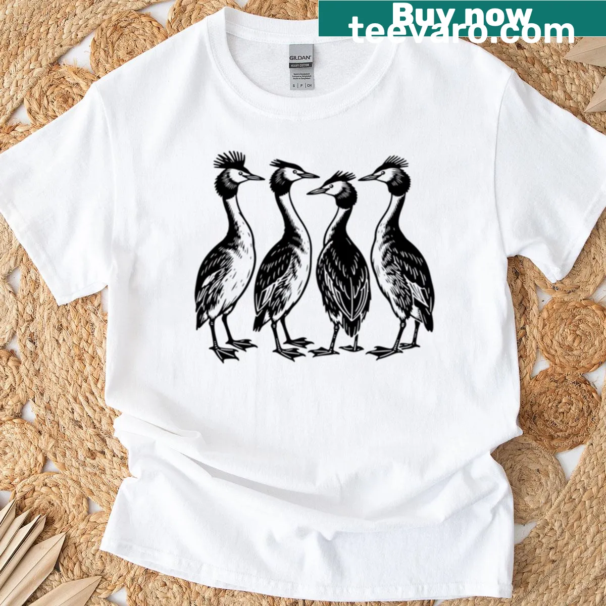 Minimalist T-shirt featuring silhouettes of Great Crested Grebes in four poses — on a men's t-shirt