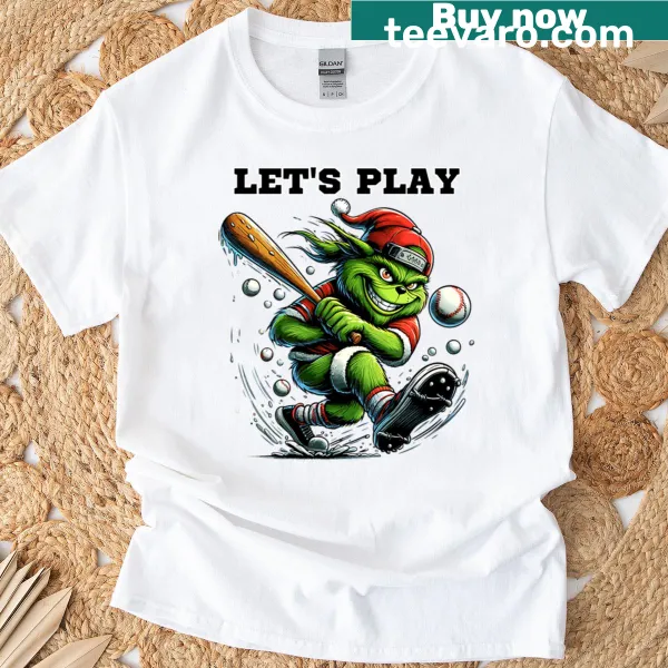 Grinch playing baseball graphic on a Christmas T-shirt