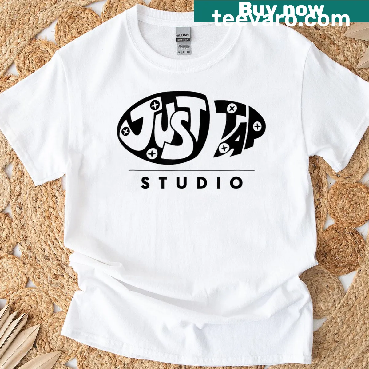 Minimalist T-shirt with Just Tap Studio black logo design — on a men's t-shirt
