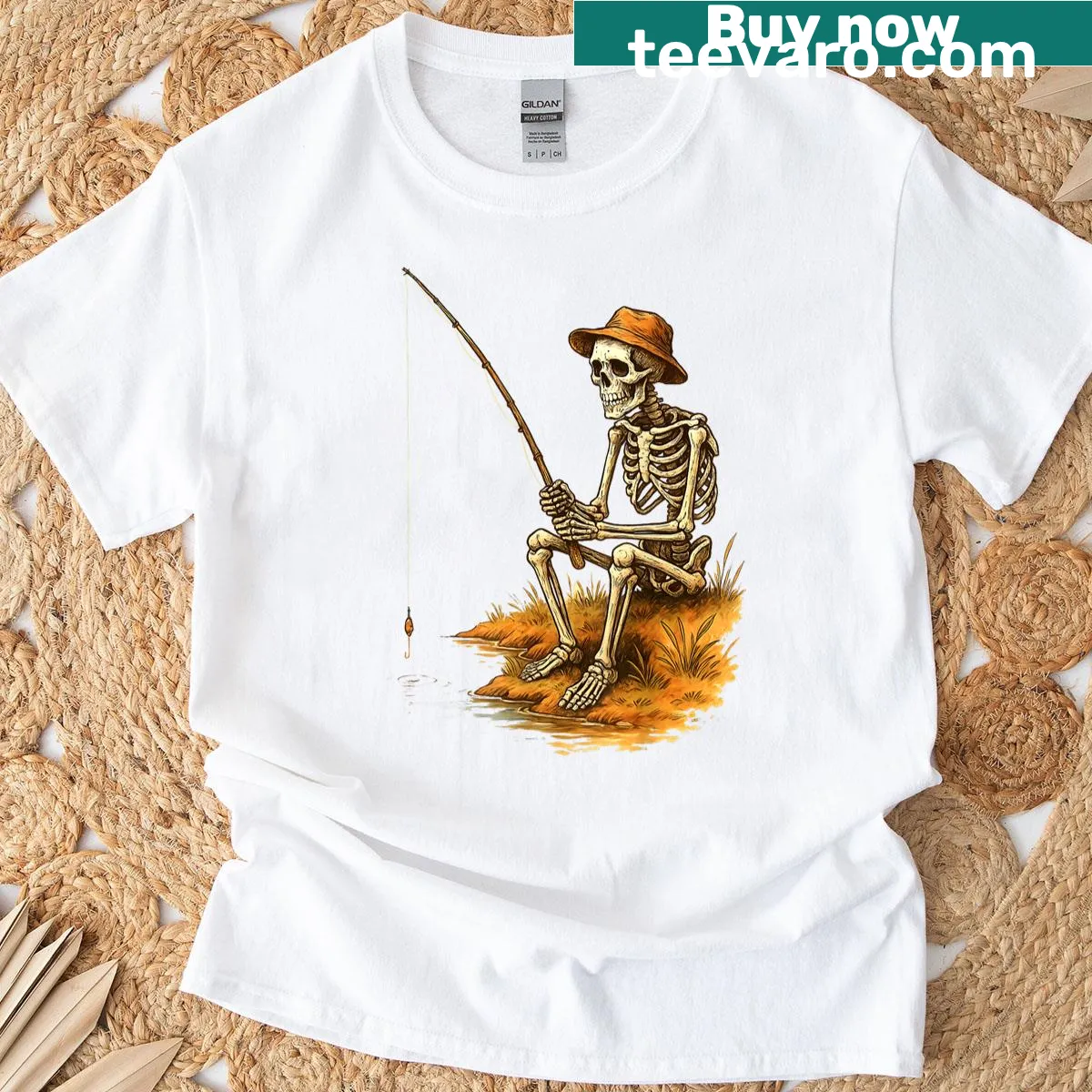 Funny Halloween T-shirt featuring a cartoon skeleton fishing design — on a men's t-shirt