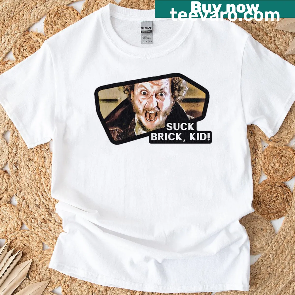 T-shirt featuring the phrase 'Suck Brick, Kid!' from Home Alone 2 — on a men's t-shirt