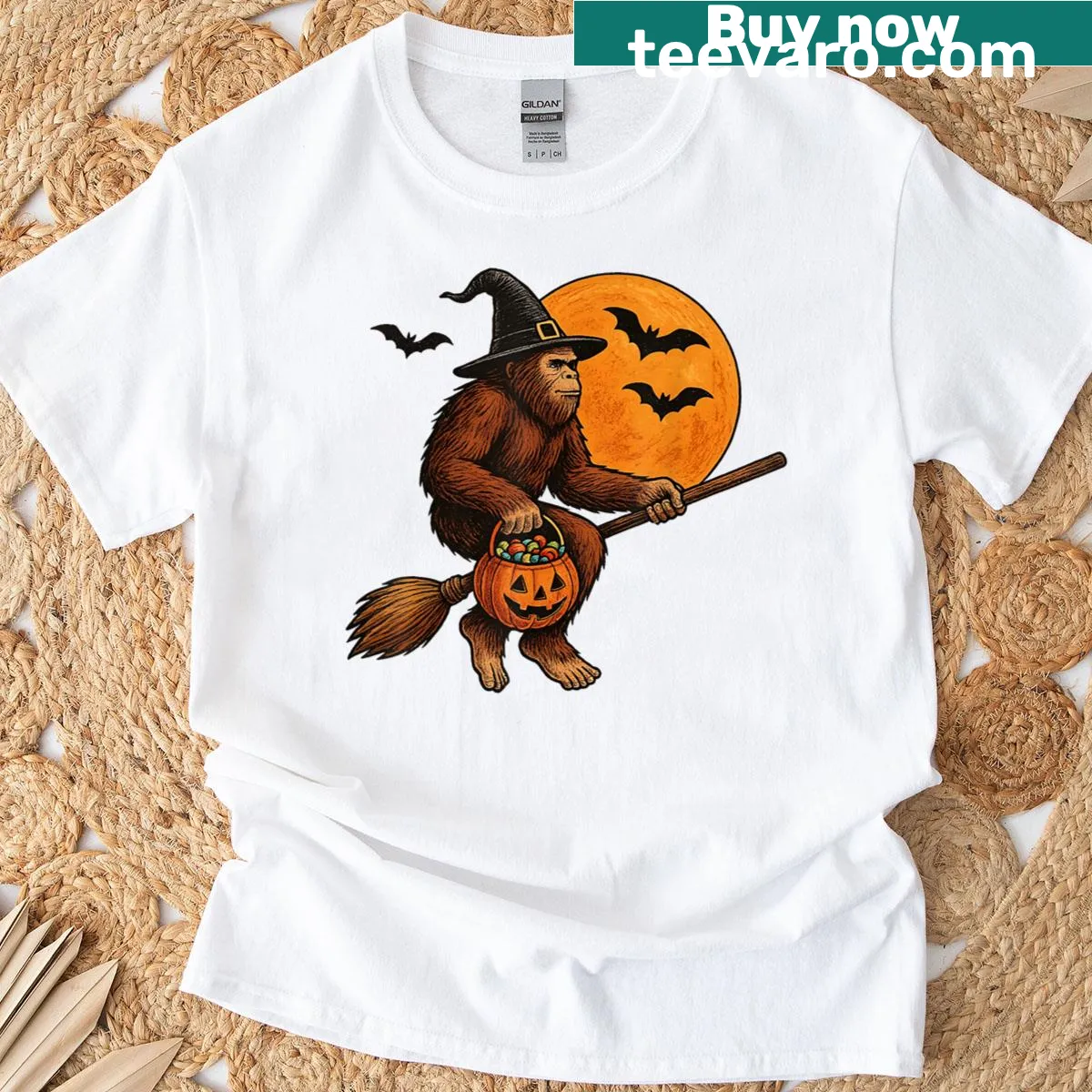 Halloween T-shirt featuring Bigfoot in a witch hat with pumpkins — on a men's t-shirt