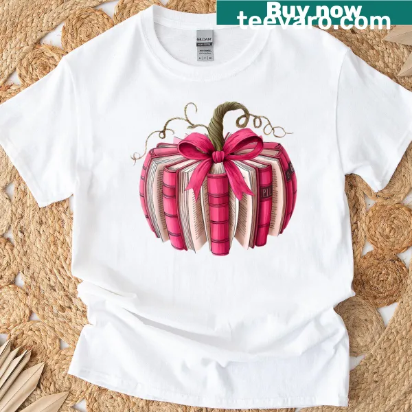 Illustrative t-shirt featuring books, pumpkins, and breast cancer awareness themes
