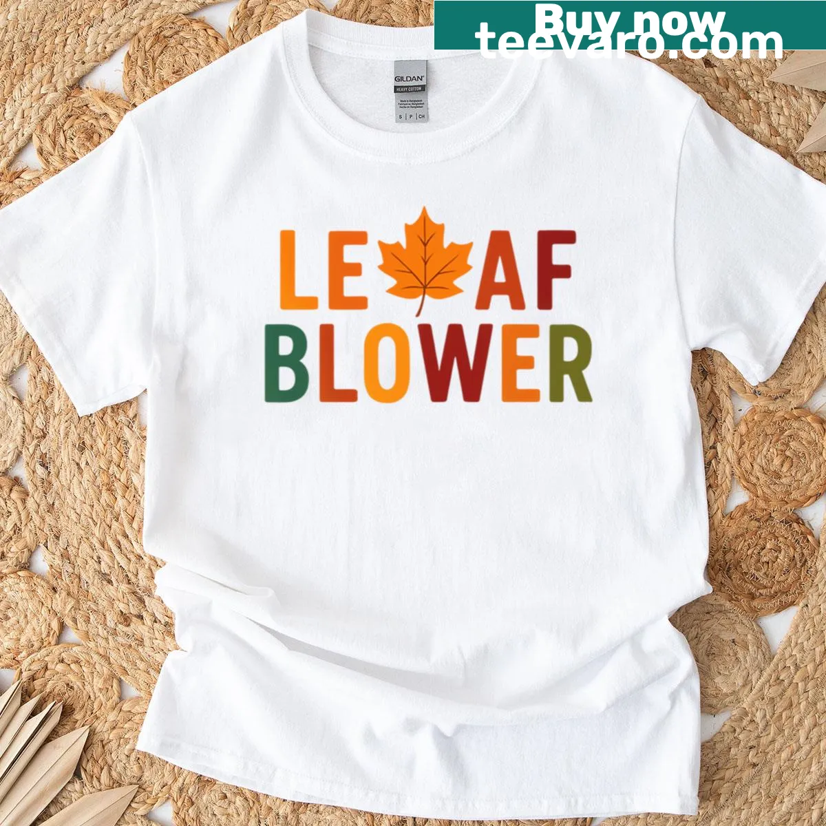 Humorous autumn-themed t-shirt with leaf blower illustration — on a men's t-shirt