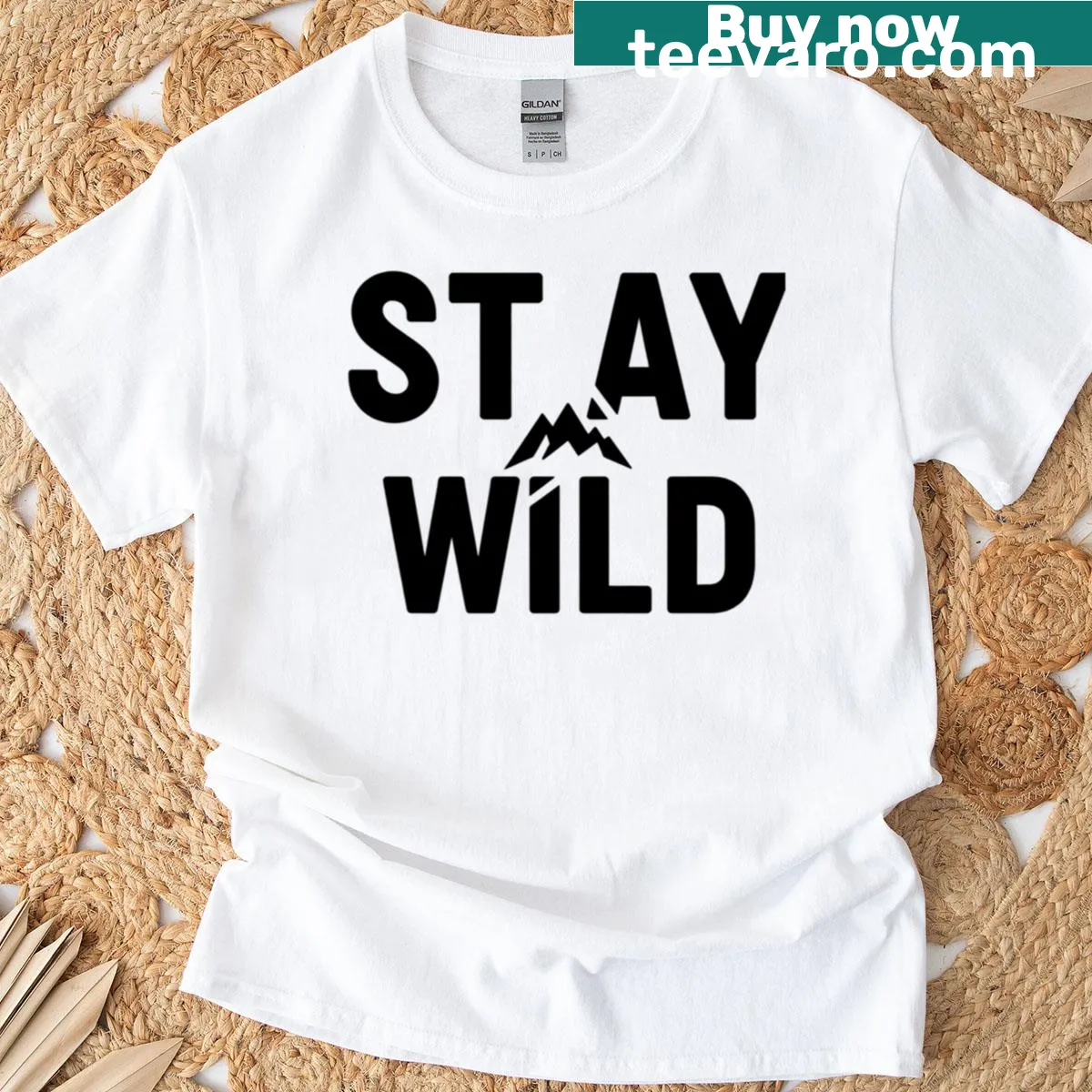 Minimalist t-shirt with 'Stay Wild' text and mountain icon — on a men's t-shirt