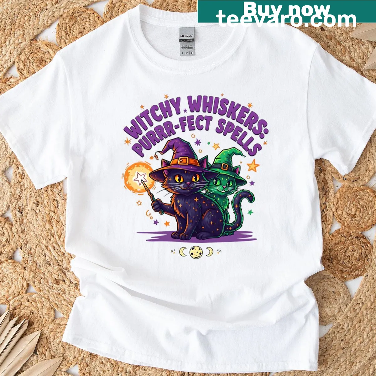Cute Halloween t-shirt featuring cats with magic hats — on a men's t-shirt