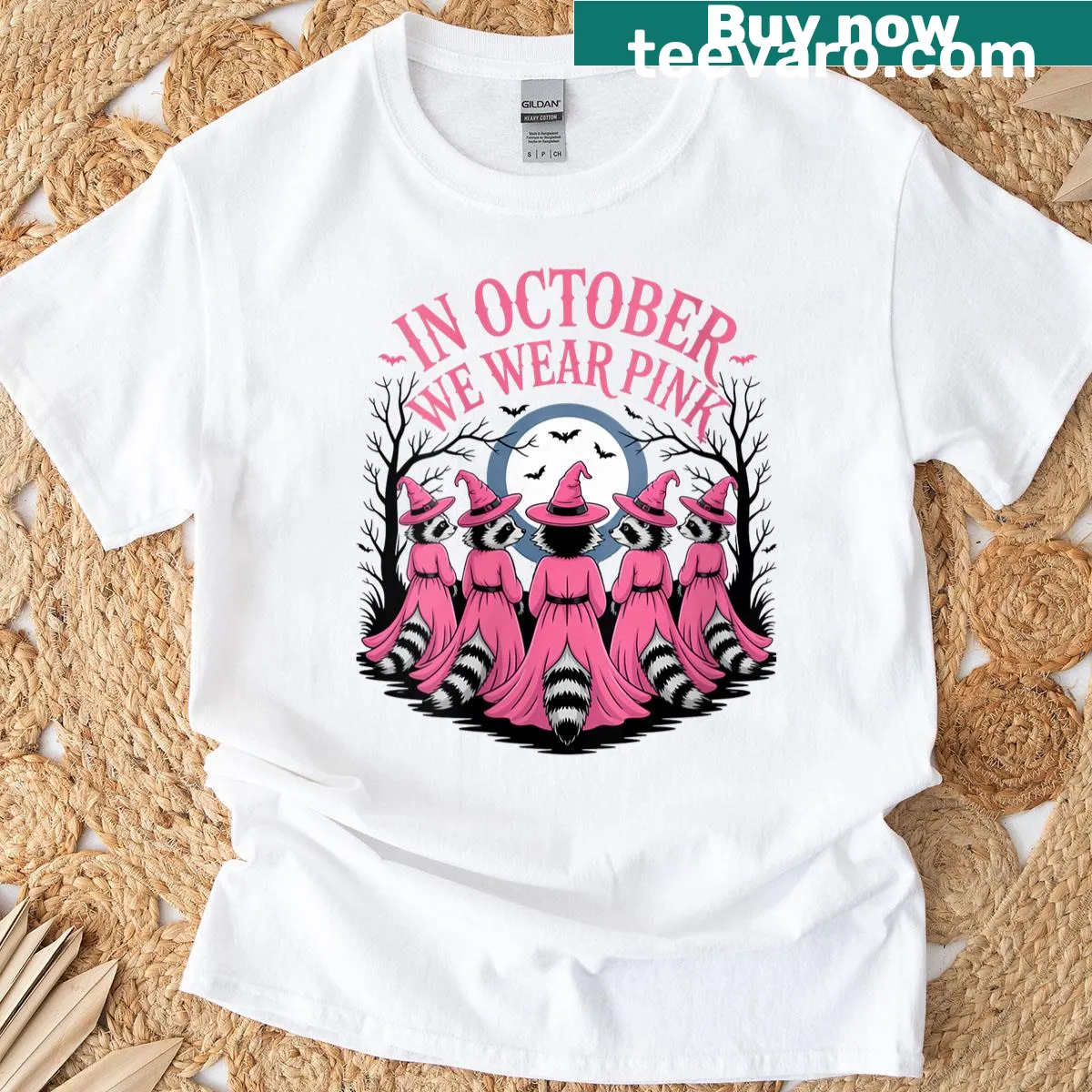 Cute Halloween T-shirt with pink witch raccoon design — on a men's t-shirt