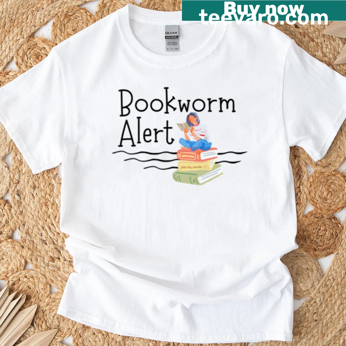 Cute t-shirt featuring a girl reading on a pile of books — on a men's t-shirt