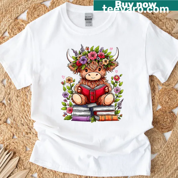 Cute baby Highland cow reading a book on a t-shirt