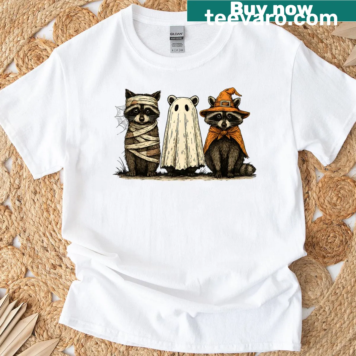T-shirt featuring a cute raccoon dressed as a ghost witch for Halloween — on a men's t-shirt