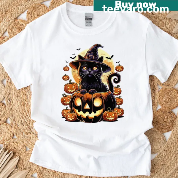 Black cat in a witch hat sitting on a pumpkin for Halloween