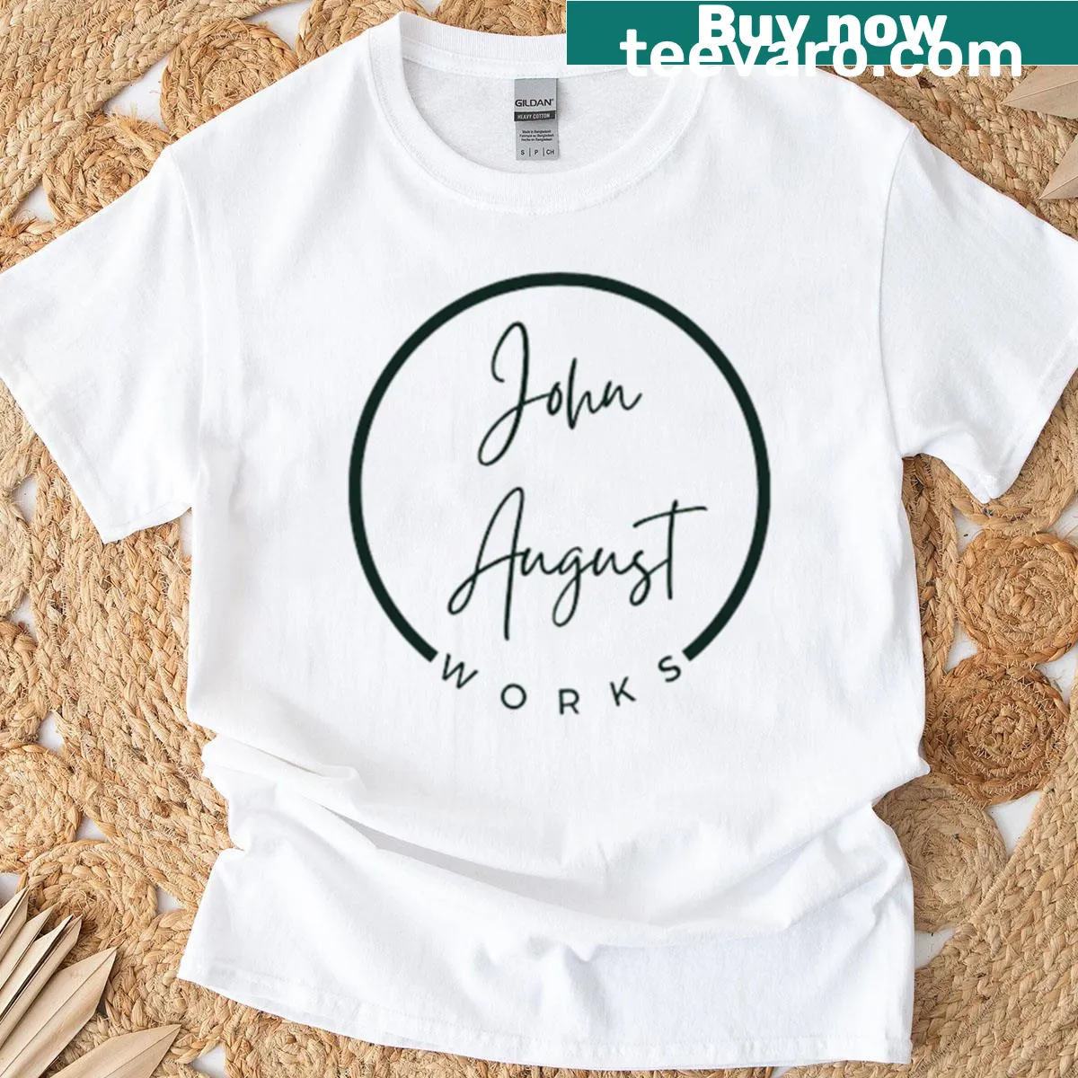 Minimalist typography graphic featuring John August Works on a t-shirt. — on a men's t-shirt