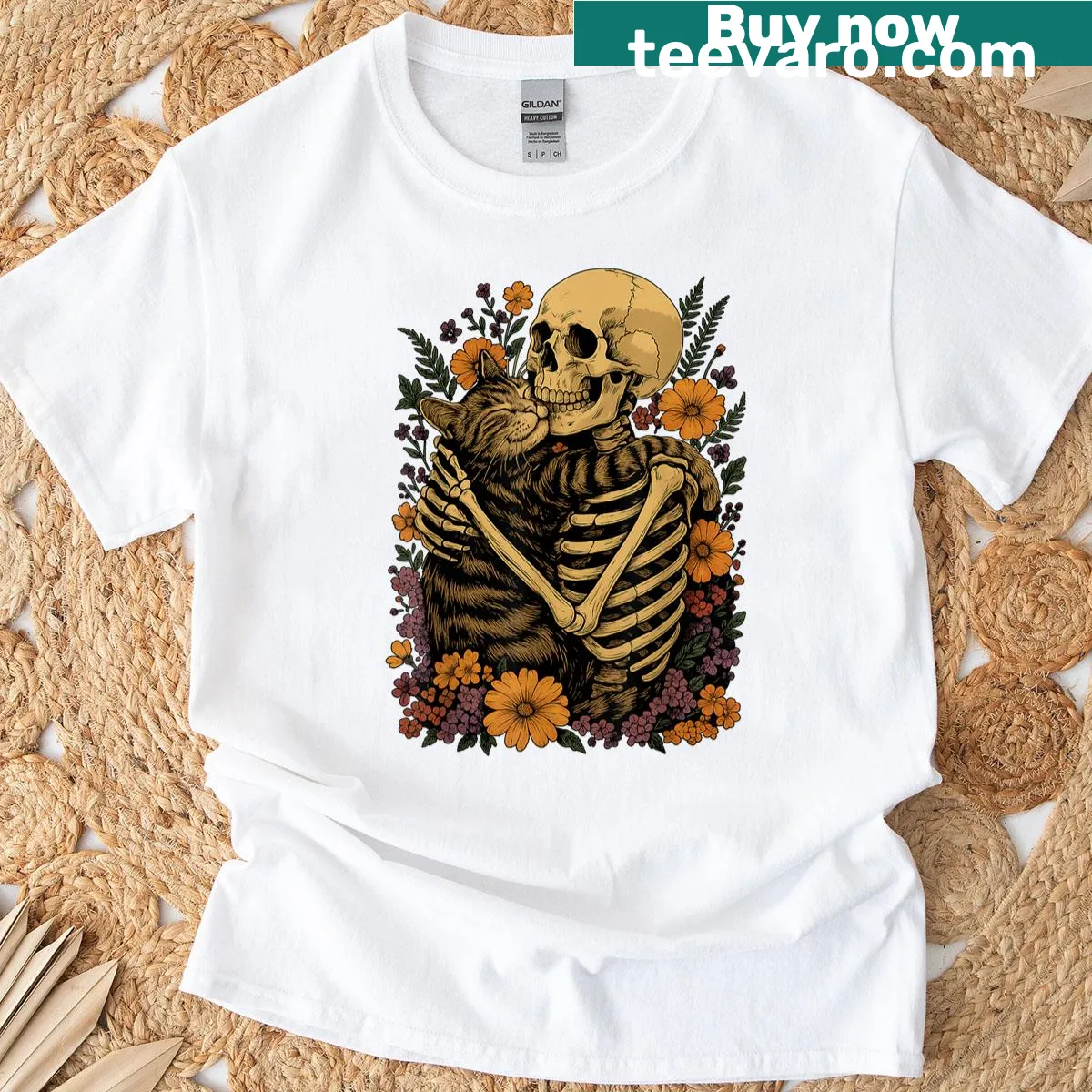 Cute skeleton hugging a cat with floral elements on T-shirt — on a men's t-shirt