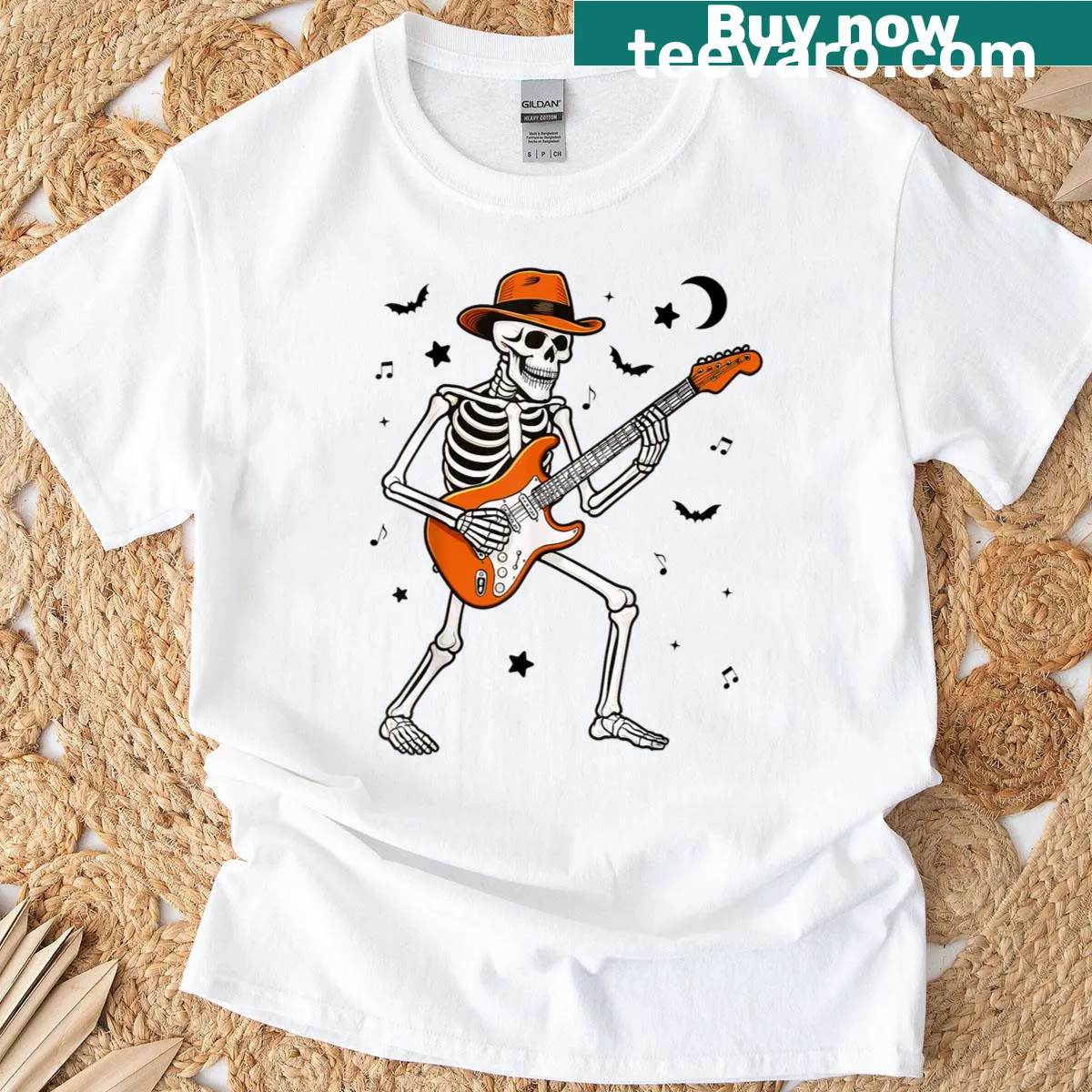 Cartoon skeleton playing guitar on a Halloween-themed T-shirt — on a men's t-shirt