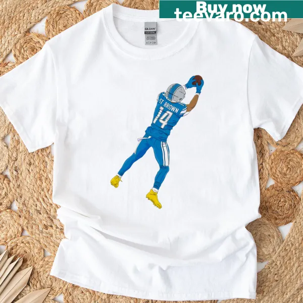T-shirt featuring a graphic of Amon-ra St Brown making a leaping catch