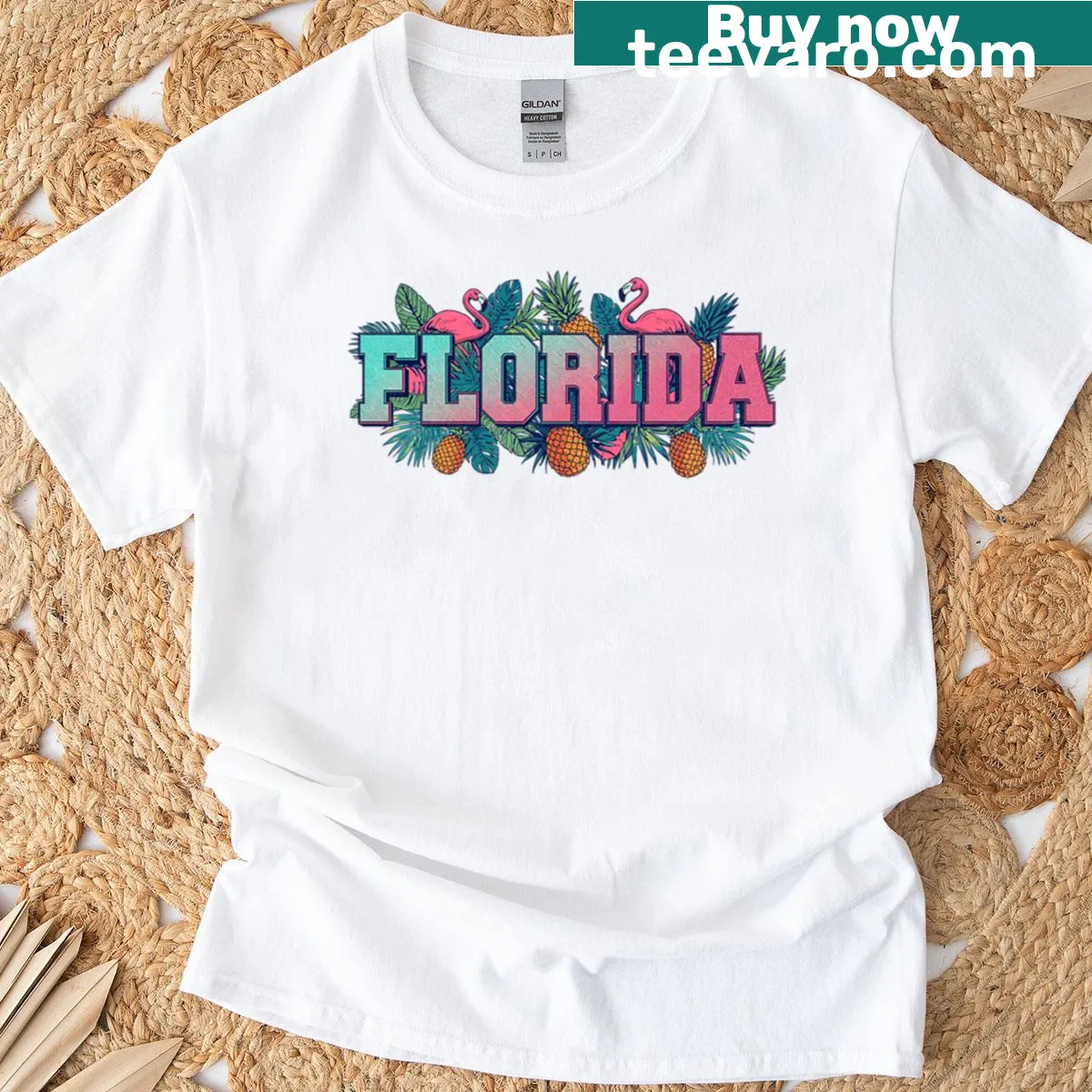 Vintage college style T-shirt with pineapple and flamingo graphic. — on a men's t-shirt