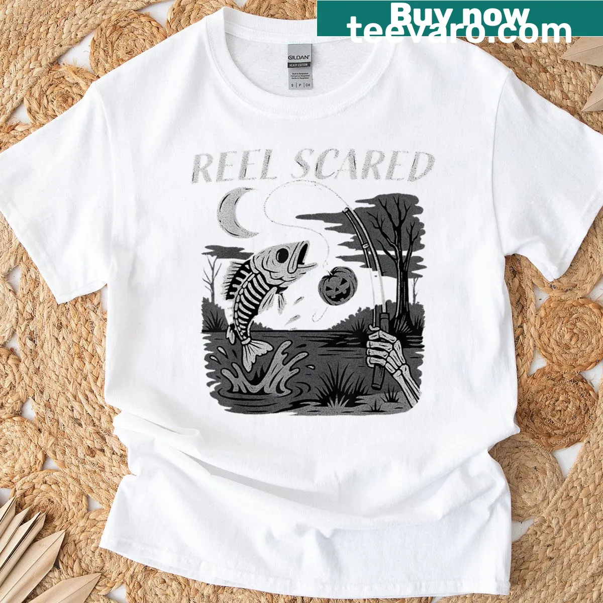 Halloween t-shirt featuring a skeleton fishing graphic — on a men's t-shirt