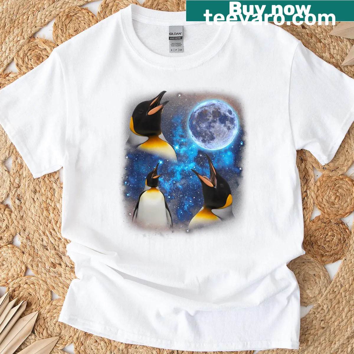 Three cartoon penguins howling at the moon design — on a men's t-shirt
