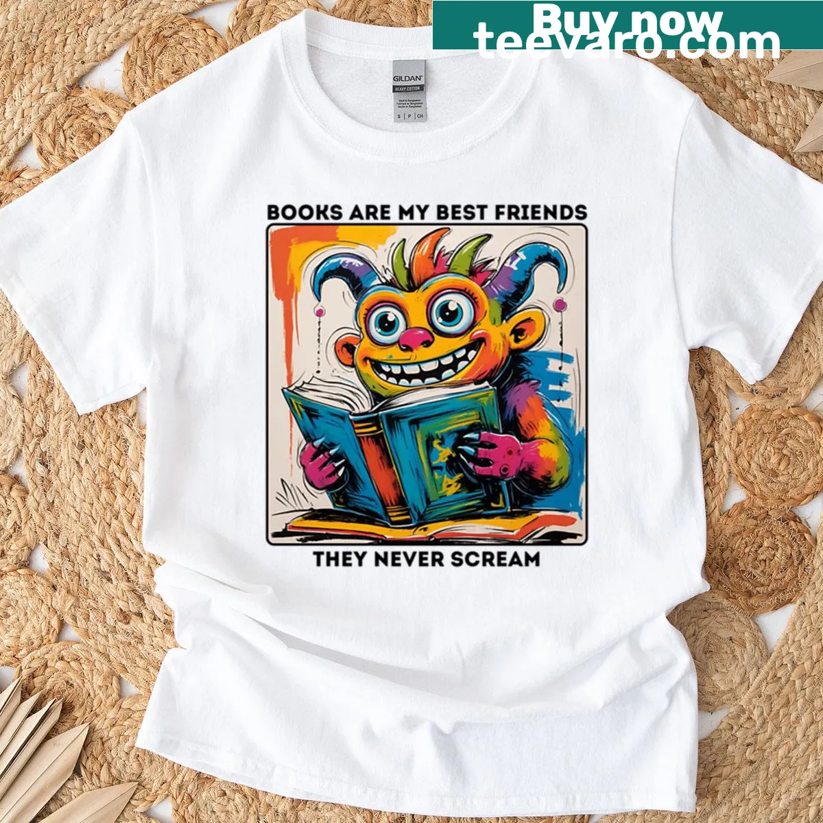 Cute t-shirt featuring a friendly monster reading a book — on a men's t-shirt