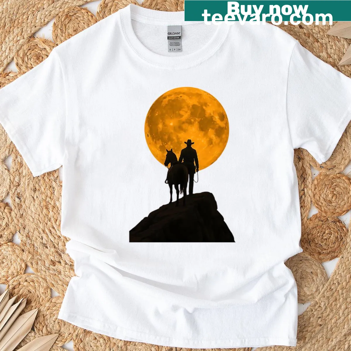 Silhouette of a cowboy and horse under a full moon on T-shirt — on a men's t-shirt