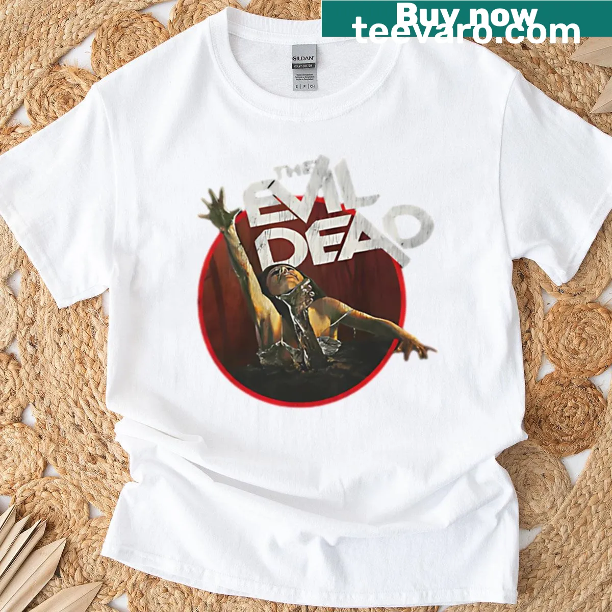 Worn-out T-shirt featuring Evil Dead themed design — on a men's t-shirt