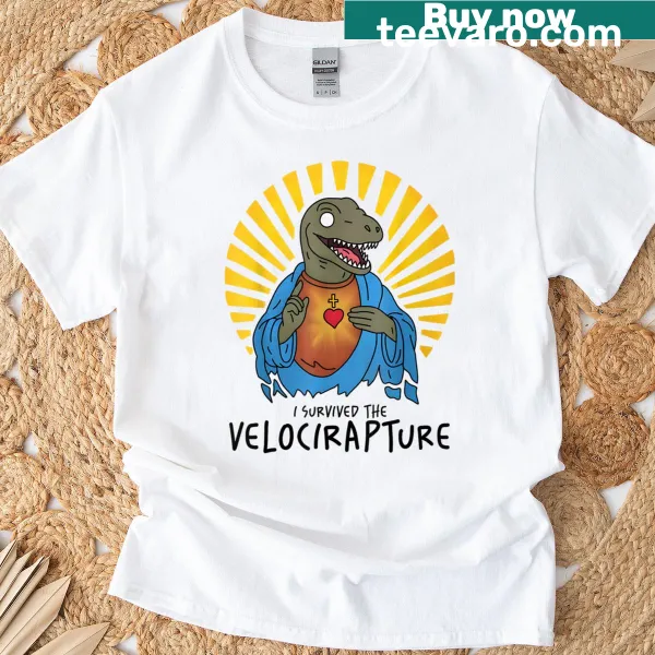 Humorous t-shirt featuring 'I Survived The Velocirapture Raptor Jesus' design